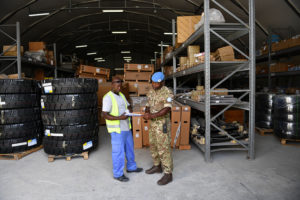 Cpl Ndongong receiving stock into the ES warehouse in Mogadishu