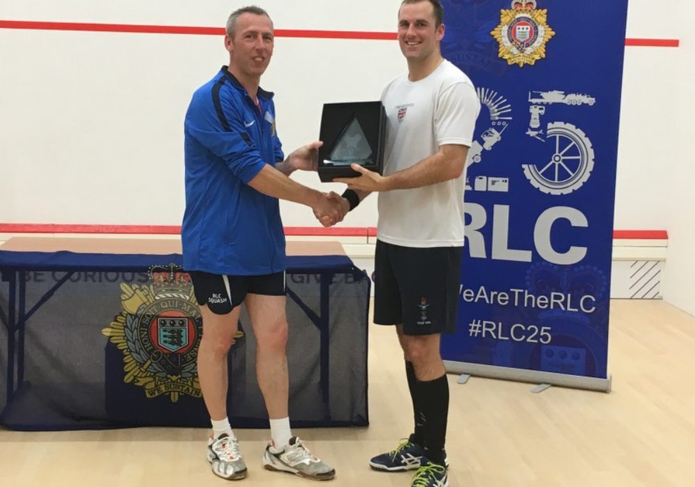 SSgt Dean Boys receiving the RLC Squash Open Champion trophy